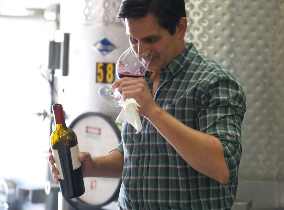 Obsidian winemaker Alex Beloz tasting wine